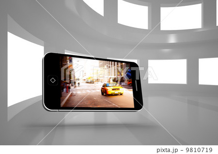 Composite image of city on tablet screen 9810719