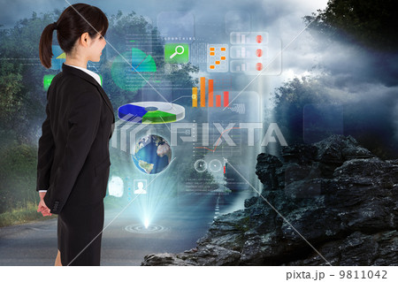 Composite image of businesswoman standing 9811042