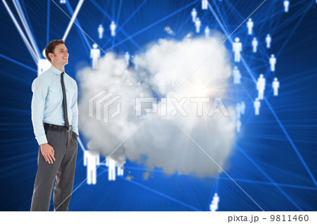 Composite image of smiling businessman standing with hand in poc Composite image of smiling businessman standing with hand in poc 9811460
