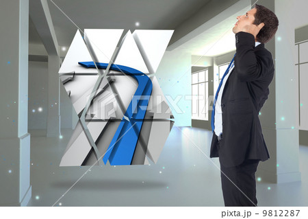 Composite image of thinking businessman scratching head 9812287