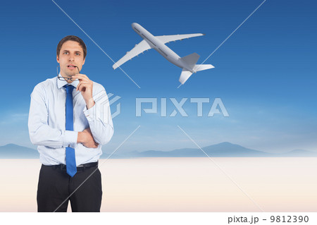 Composite image of thinking businessman biting glasses 9812390