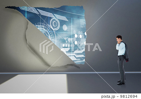 Composite image of serious businessman holding his jacket Composite image of serious businessman holding his jacket 9812694