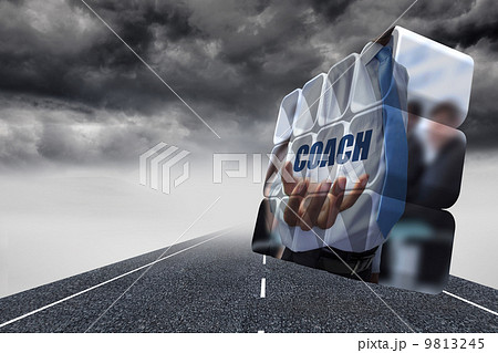 Composite image of businessman holding coach text on abstract sc 9813245