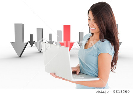 Composite image of good looking woman relaxing with her laptop 9813560