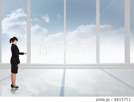 Composite image of businesswoman pointing 9815751