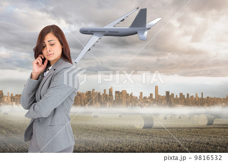 Composite image of worried businesswoman 9816532