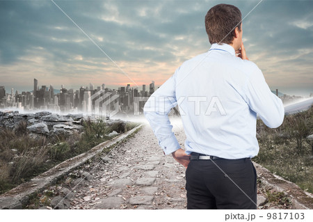 Composite image of thinking businessman touching his chin 9817103