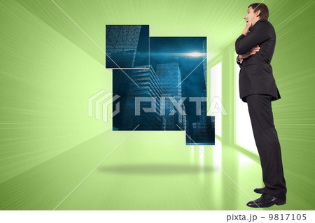 Composite image of thinking businessman touching chin 9817105