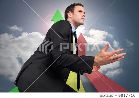 Composite image of businessman posing with arms out 9817716