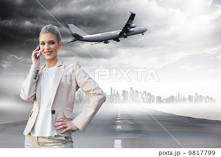 Composite image of cheerful elegant businesswoman on the phone Composite image of cheerful elegant businesswoman on the phone 9817799