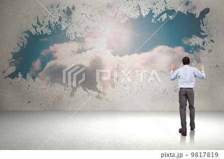 Composite image of businessman posing with hands up Composite image of businessman posing with hands up 9817819