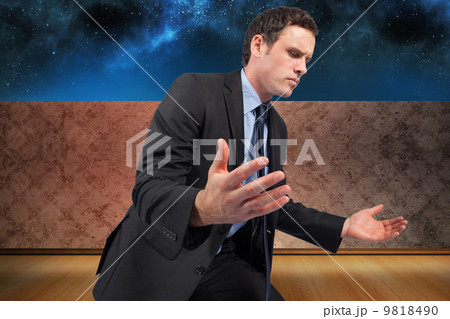 Composite image of businessman posing with arms out 9818490