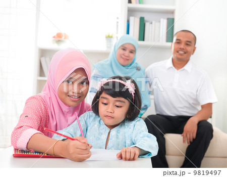 malay family learning together 9819497