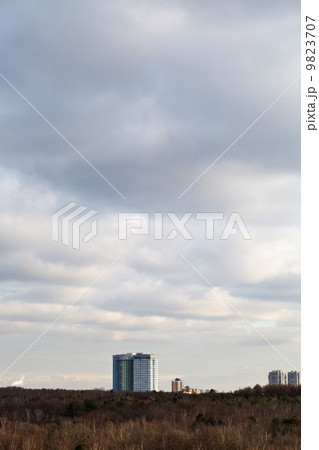 evening clouds over apartment house house 9823707