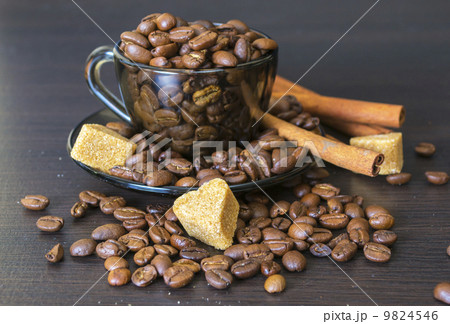 Coffee Beans, Cup, Pots, Cinnamon on Dark Background 9824546