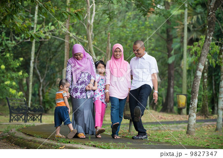 malay family having fun in the park ,malaysian people malay family having fun in the park ,malaysian people 9827347