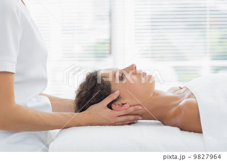 Woman receiving body massage in health spa Woman receiving body massage in health spa 9827964