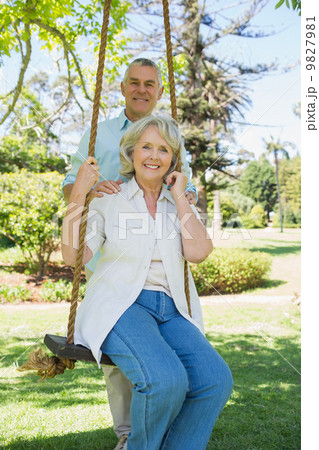 Portrait of a happy mature couple at park Portrait of a happy mature couple at park 9827981
