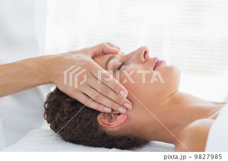 Woman receiving head massage Woman receiving head massage 9827985