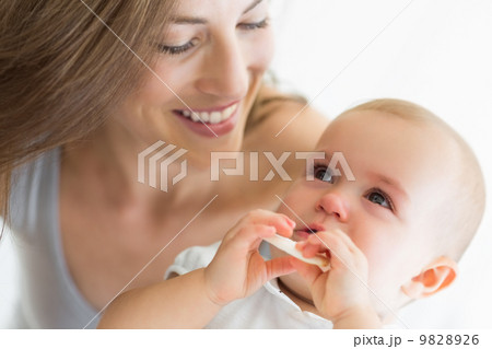 Closeup of smiling mother and baby 9828926