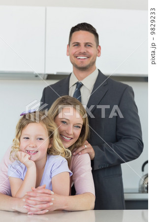 Family smiling together at table Family smiling together at table 9829233