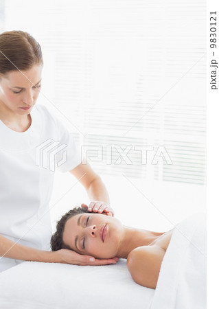 Physical therapist massaging woman Physical therapist massaging woman 9830121