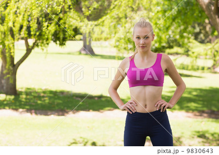 Healthy and beautiful woman in sports bra in park Healthy and beautiful woman in sports bra in park 9830643