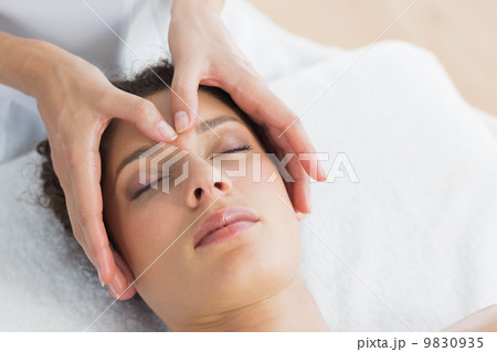 Beautiful woman having head massage Beautiful woman having head massage 9830935