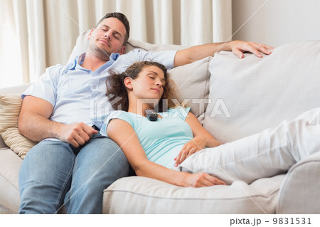 Couple relaxing on sofa 9831531