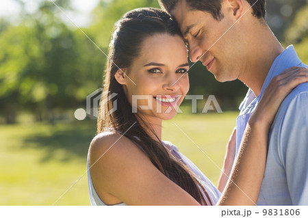 Loving and happy young couple at park 9831806