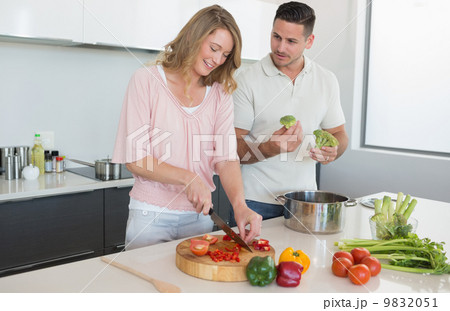 Couple preparing food in kitchen Couple preparing food in kitchen 9832051