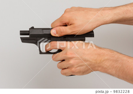 Pistol in hand, isolated Pistol in hand, isolated 9832228