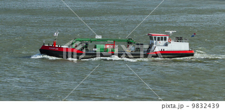 Small chemical tanker sailing in the port of Rotterdam (Holland) 9832439