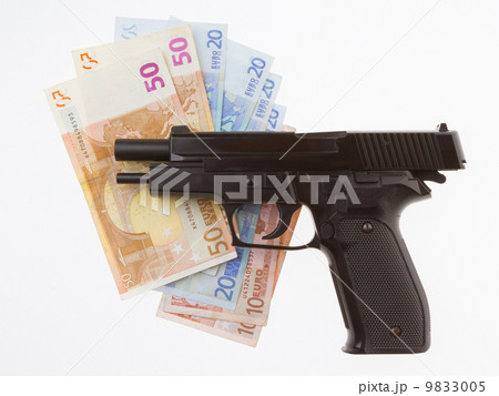 Semi-automatic gun and money isolated 9833005