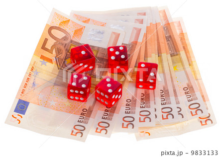 Red dice on top of some 50 euro banknotes 9833133