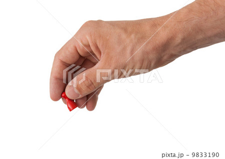 Hand holding a red pawn 9833190
