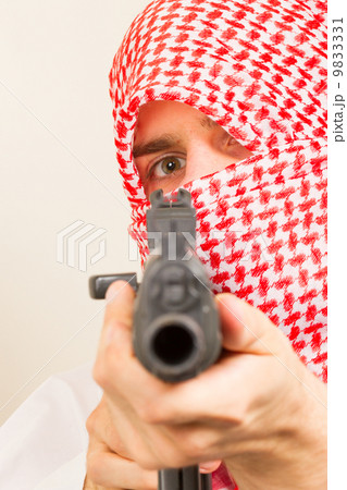 Arab adult with a machine gun, terrorist 9833331