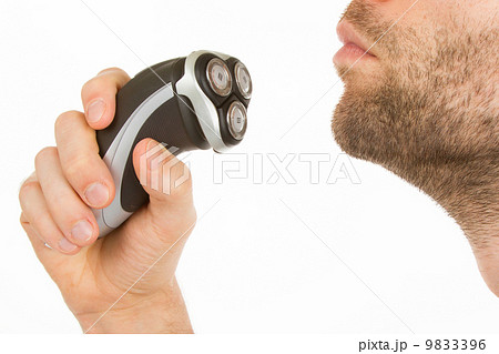 Young man shaving his beard off 9833396