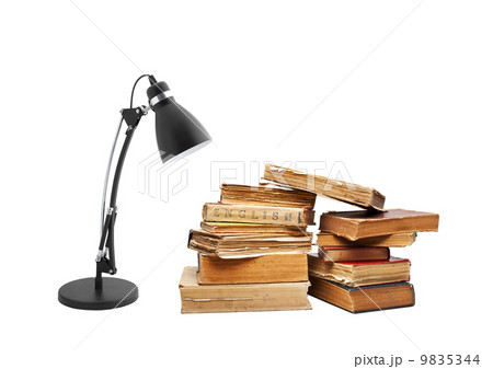 old books with a lamp 9835344
