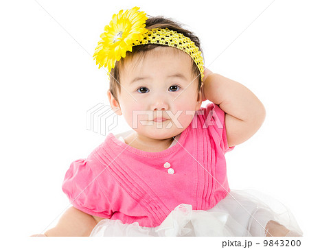 Asian baby girl scratching her head Asian baby girl scratching her head 9843200