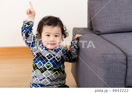 Asian baby finger pointing up 9843222