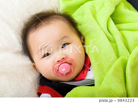Asian baby with pacifier Asian baby with pacifier 9843223