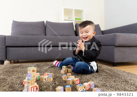 Asian kid playing toy block 9843321