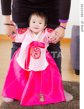 Traditional korean costume baby try to stand up 9843594