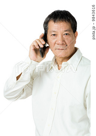 Asian senior man using mobile Asian senior man using mobile 9843616