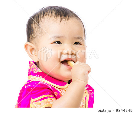 Chinese baby eating biscuit 9844249