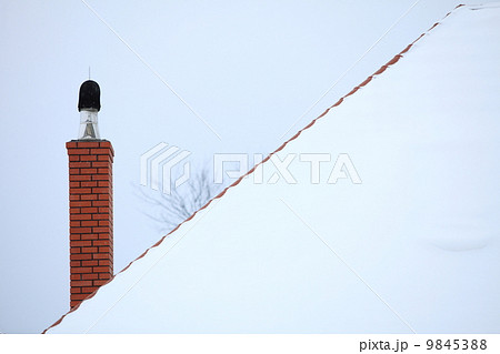 chimney on the snow covered roof chimney on the snow covered roof 9845388