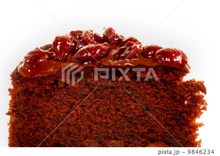 Piece of chocolate cake with icing and cherry 9846234