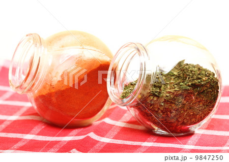 jars with spices paprika and lovage isolated 9847250