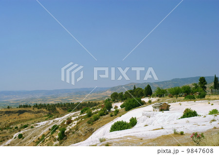 Travertine pools and terraces with water, Pamukkale, Turkey 9847608